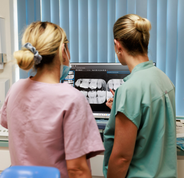 Poynton Dental team overlooking xray